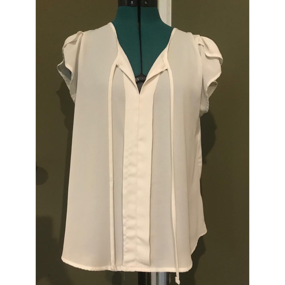 Off-white blouse with pleat and tie detail